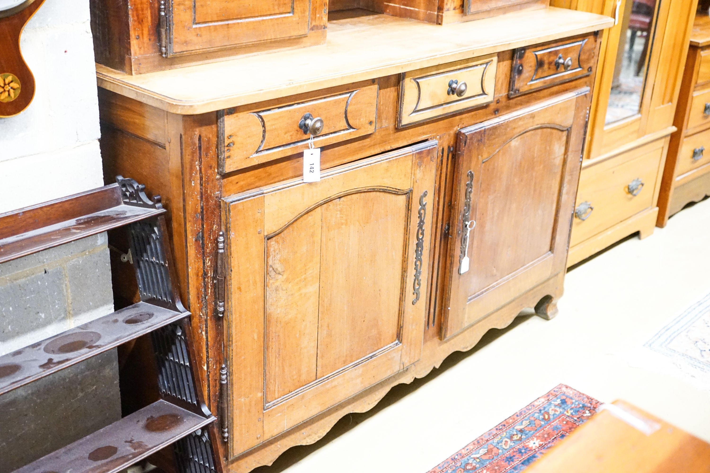 A late 18th / early 19th century French fruitwood dresser, length 160cm, depth 57cm, height 240cm